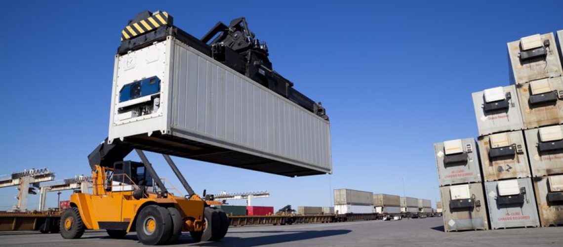 A crane lifting a freight container.